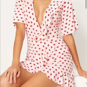 Pink Heart Print Frill Wrap. Light pink with red hearts